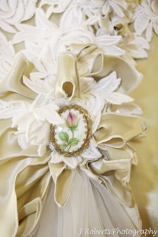 Antique brooch détails on wedding dress - wedding photography sydney